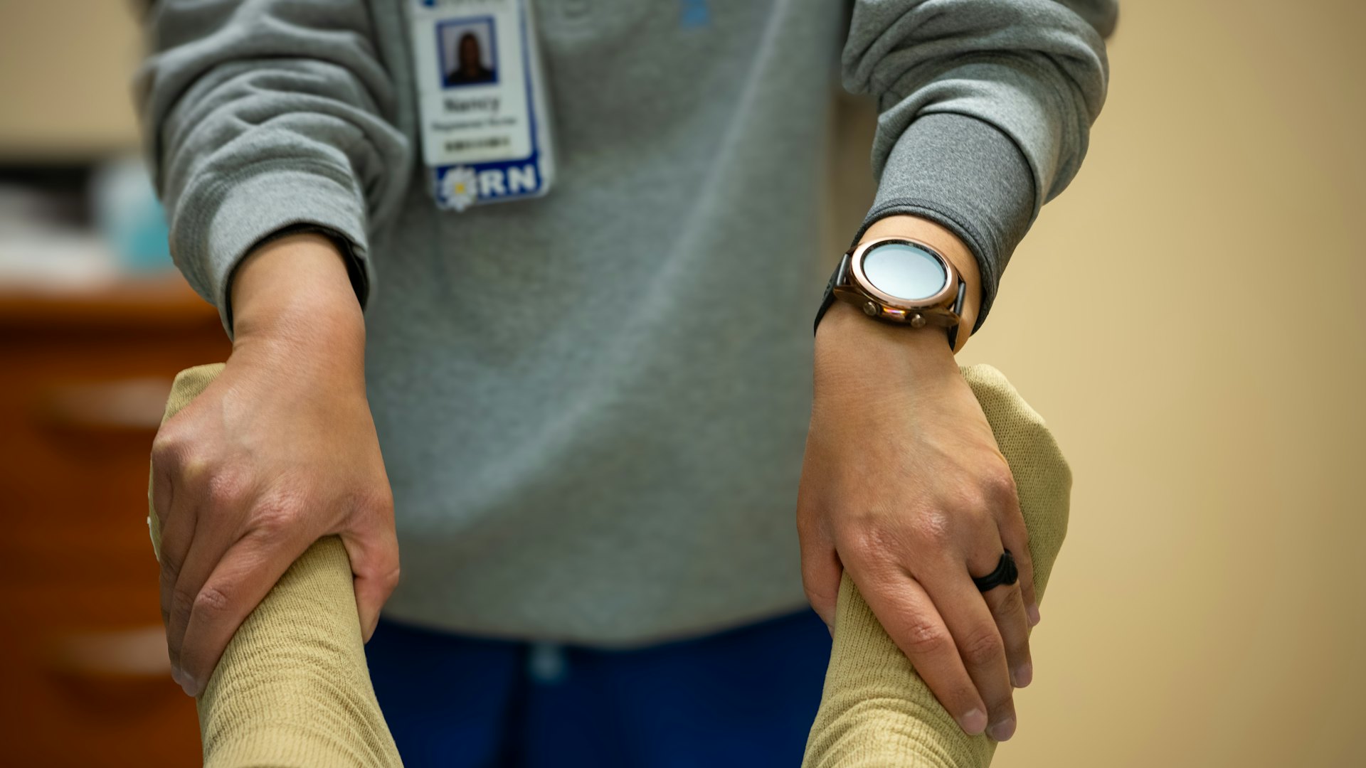 Physiotherapist working hands-on with a patient's leg