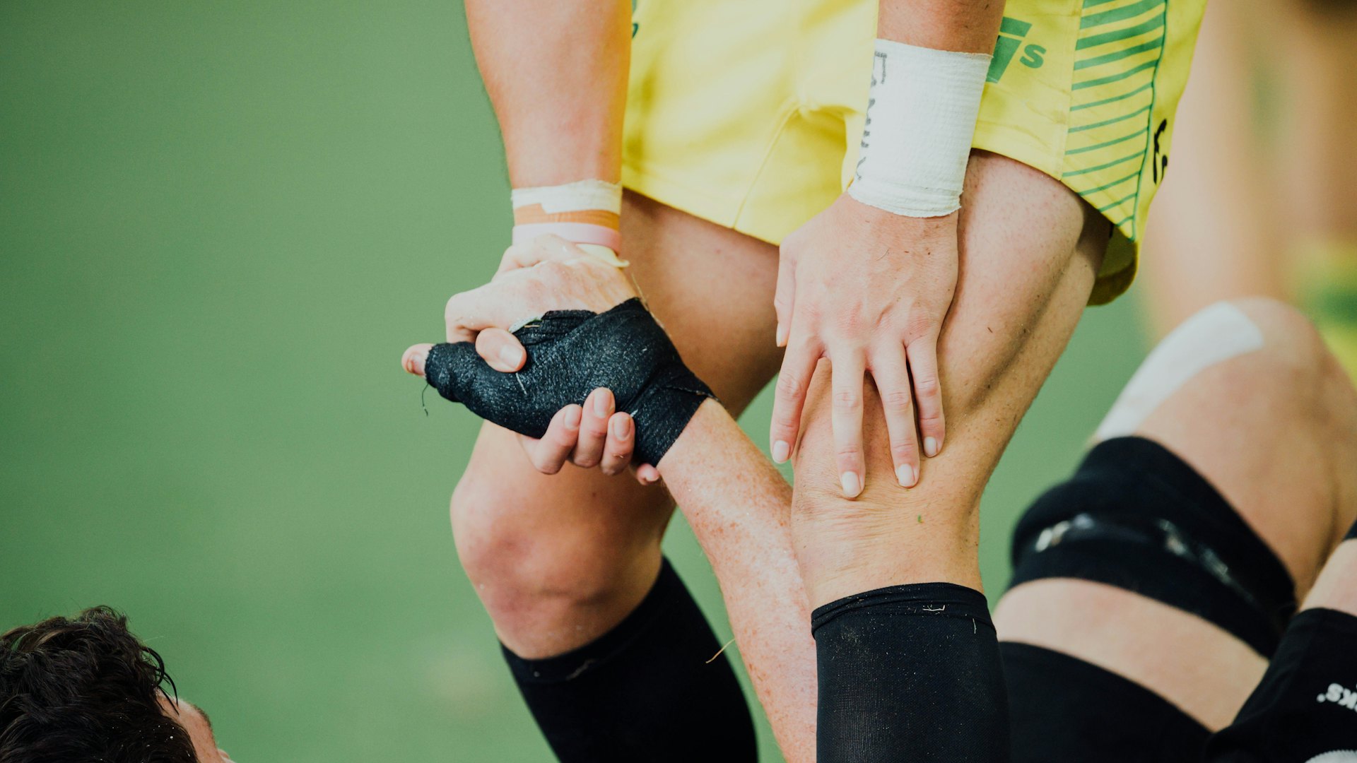 Athlete with a lower-leg sports injury on the field